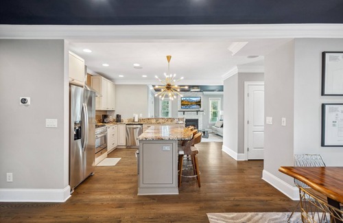 Commonwealth Park House | Luxury Charlotte Home with Stunning Pool & Hot Tub & Waterfalls