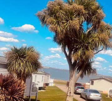 Isle of Grain Apartment | Luxury family Caravan with decking and a sea view at Kent coast sleeps 6