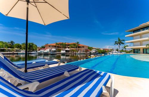 Puerto Aventuras Apartment | Luxury Ground Floor MarinaView-Pool-Gym-Paddleboard