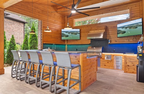 Buford House | Luxury Lakefront retreat. Privacy gate, pool and outdoor kitchen