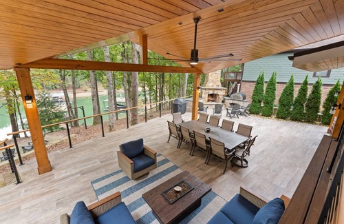 Buford House | Luxury Lakefront retreat. Privacy gate, pool and outdoor kitchen