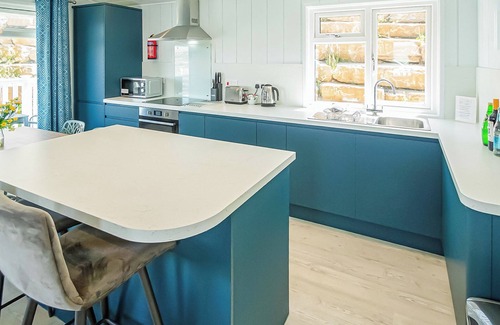 Swanage Ski Chalet | Luxury lodge with one double with en suite shower and one twin.