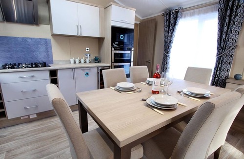 Swanage Ski Chalet | Luxury lodge with one double with en suite shower and one twin.