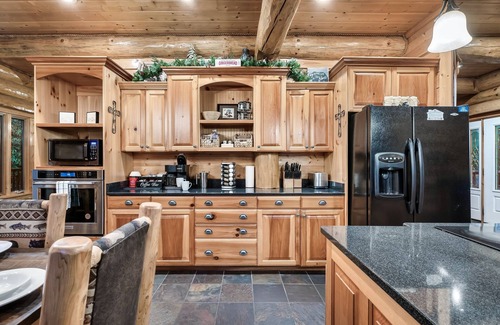 Pittman Center Cabin | Luxury Log Cabin Hot Tub, fire pit, mountain stream, all king suite on 2 acres