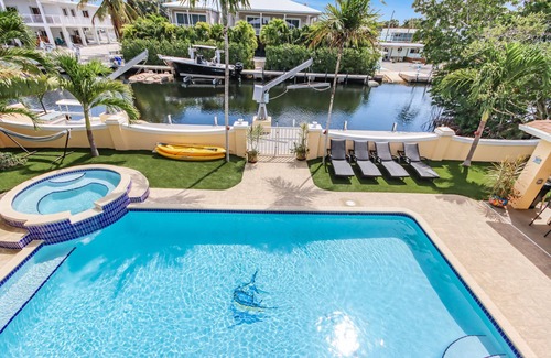 Twin Lakes House | Luxury Water Front Home, Private Pool, Spa, Tiki Bar, 75' Foot Dock with Kayaks
