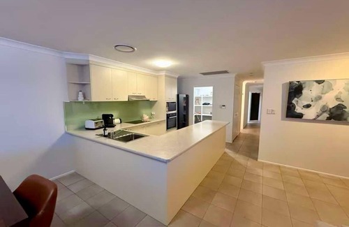 Bongaree House | Luxury Waterfront Retreat: Pet friendly Canal Home with Jetty on Bribie Island!