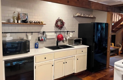 Exhibition Park House | Magnificent 1867 Coach House, private patio, 2 minute walk to downtown