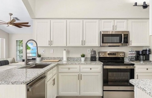 Punta Gorda House | MAGNIFICENT! LUXURY WATERFRONT HOME;BIG HEATED POOL-80’ DOCK! 5 MIN FISH VILLAGE