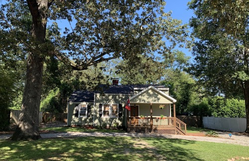 Pendleton King House | Masters rental with spacious back porch, fenced in yard, and park frontage.
