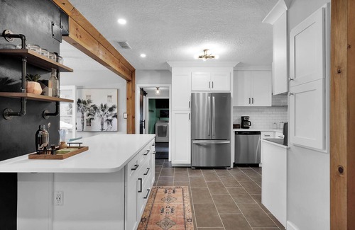 Lakewood House | Mid-Century Boho Chic home with Pool, Game Room & Outdoor Playhouse.