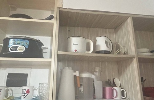 Imus Condo | Minimalist Room in Imus Condo with netflix and round-clock Security