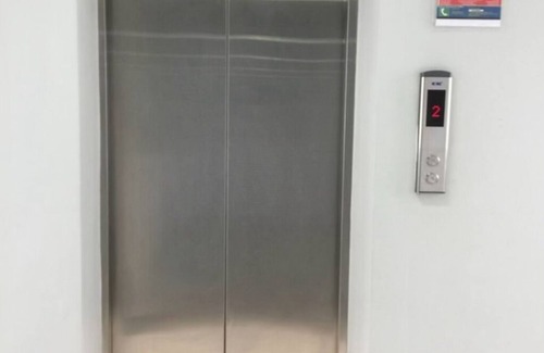 Imus Condo | Minimalist Room in Imus Condo with netflix and round-clock Security