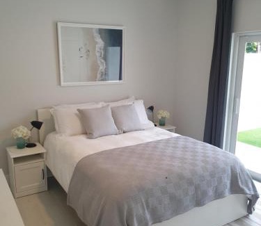 West Bay Apartment | Modern 1 bedroom walking distance to the beach!
