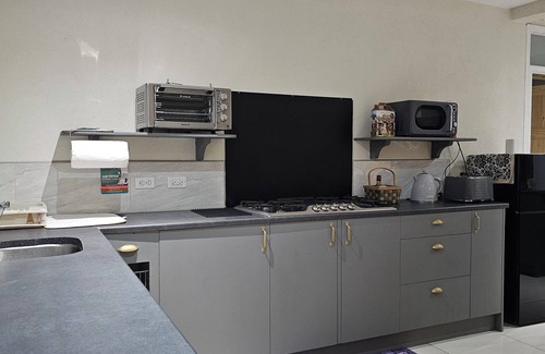 Oistins House | Modern 2 bedroom apartment. 10 minute walking distance from the beach.