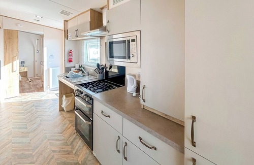 Bleadon House | Modern and contemporary 12ft-wide caravan with two twin.