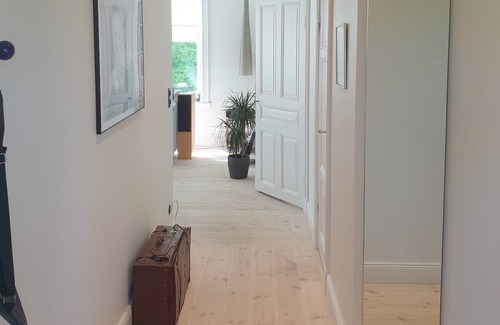 Solna Apartment | Modern apartment in 19th-century villa close to city, sea and royal gardens.