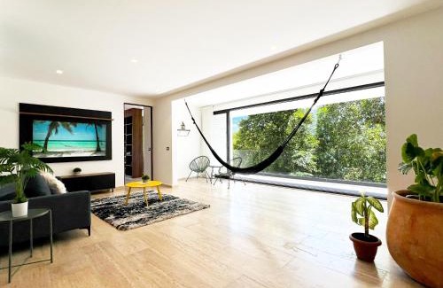 Puerto Aventuras Apartment | Modern Apartment with Private Terrace and Golf Course View, free parking in Puerto Aventuras