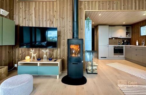 Svingvoll House | Modern cabin Skeikampen with ski-in out cross country trails & great view