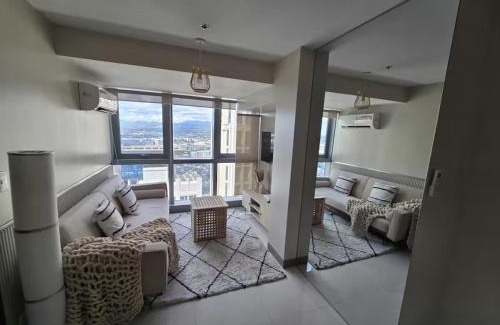 Bagumbayan Apartment | Modern Comfort & Snap Worthy with Pool, Gym & More