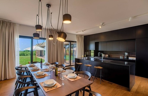 Porec Villa | Modern-designed villa with indoor-outdoor pool in Istria surrounded by nature on a large property which ensures privacy.