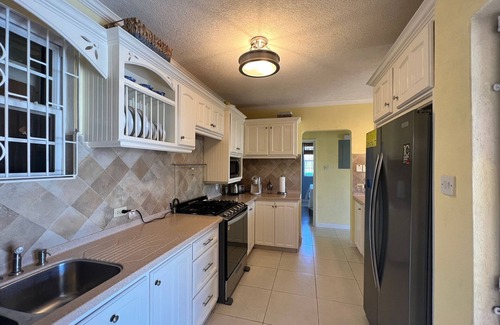 Oistins House | Modern Home Close to Beach, Oistins, Surfing. Secondary Rental on Premises.