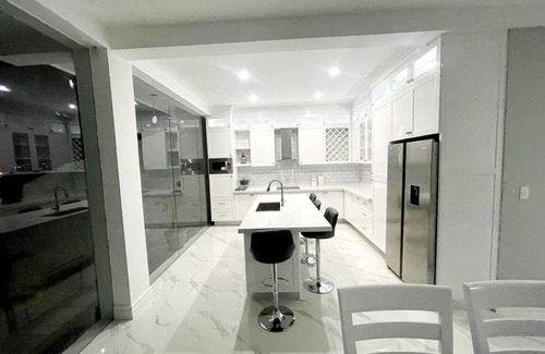 Tequesquitengo House | Modern Lakeside Retreat: Beach Access, All-White Tile, & Stylish Décor