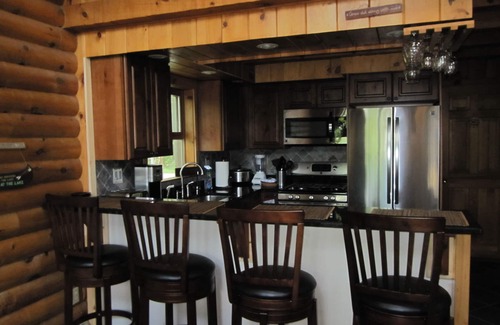 Wells Ski Chalet | Modern Log Home with 70 feet of lakefront! Great Fishing and Swimming!