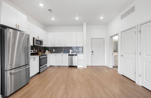 Downtown Louisville Apartment | Modern Nulu 2BR Cozysuites 02