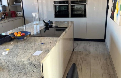 Exmouth House | Modern renovated air conditioned bungalow with sea views