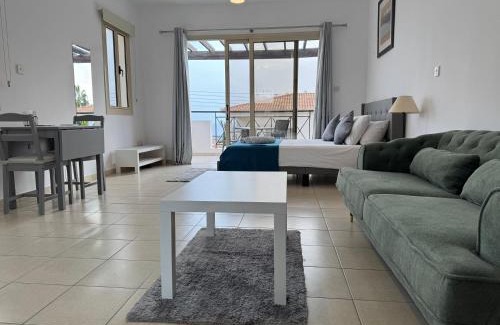 Peyia Town Apartment | Modern Studio with Pool and Balcony Hillside and Sea Views For Business or Leisure Travellers