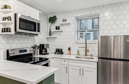 Kensington House | Modern Two Bedroom Family Retreat, Fireplace outside of Fishtown