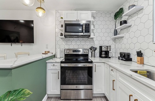 Kensington House | Modern Two Bedroom Family Retreat, Fireplace outside of Fishtown