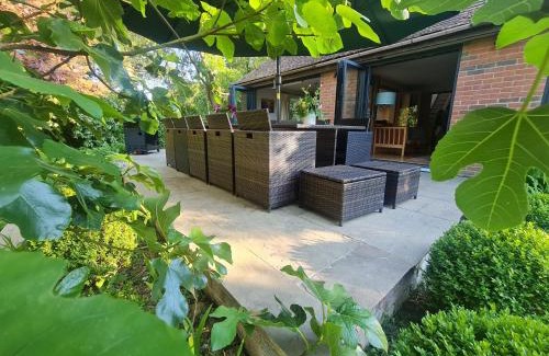 Abbess Roding House | Modernised seven bedroom country house and garden with hot tub