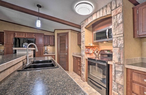 Powell House | Monett Family Ranch Home w/Fireplace & Huge Deck!