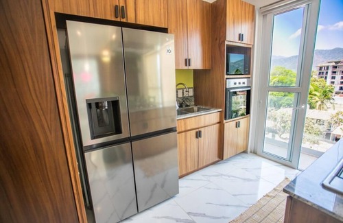 Fluvial Vallarta Apartment | Mountain view Condo + infinity rooftop Pool in foodie district. Fast WiFi