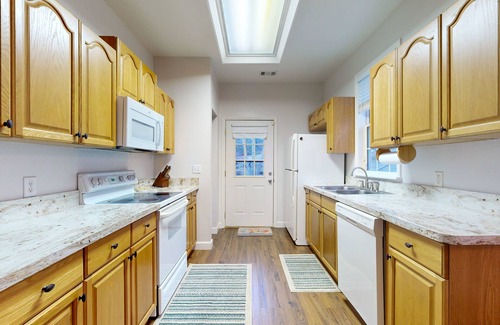 Sylva House | Mountain view home with a fireplace with beautiful view of the creek