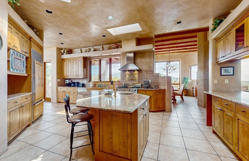 Santa Fe House | Mountain-view magic - large home office, chef’s kitchen, wraparound patio
