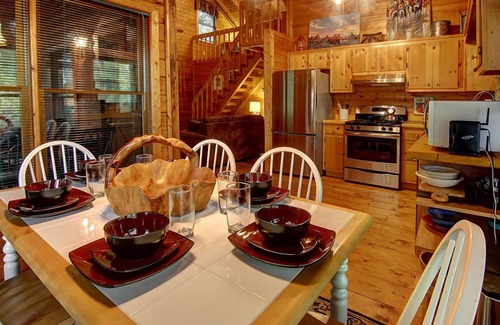 Hidden Lake Cabin | Mountain Vista is pet friendly with a Mountain view, hot tub and fire-pit and a screened porch. WiFi