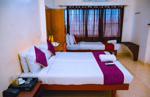Koyambedu Hotel | Naksha Tree Hotels Kishore Inn - Koyambedu