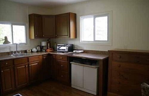 Milford Cottage | Nature Lover's Cottage Retreat On The Black River With Private Dock.