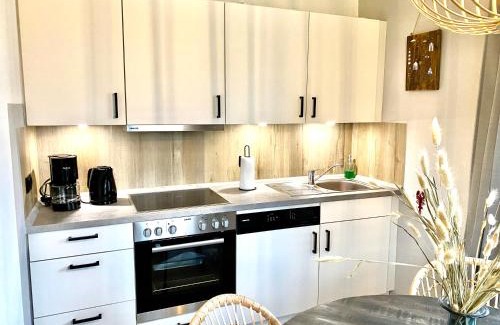 Neßmersiel Apartment | Nessmersiel, Renovierte Erdgeschosswohnung mit Garten in Deichnähe, Wallbox, Bettwäsche inklusive