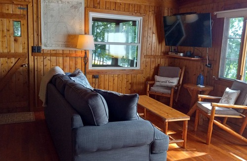 Omena House | New! Beautiful Sunset Views from this wonderful log home with Kayak, Firepit