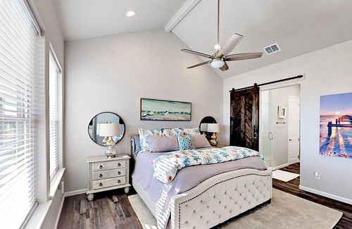 City-by-the Sea House | New Canal-Front Home | Private Boat Dock, Hot Tub, Balcony & Patio with Grill