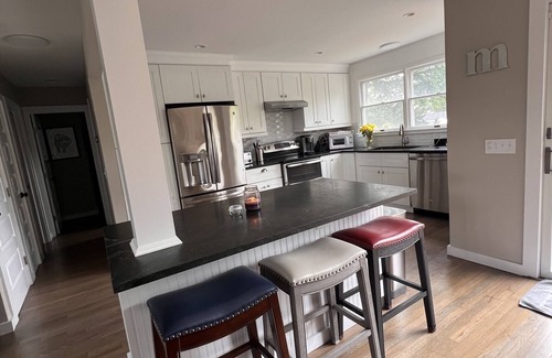 Westhampton House | New deck, pool liner, ac, doors, hardwoods, paint, electric fireplace, etc.