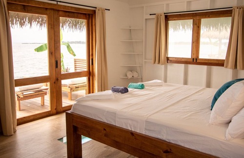 Isla Solarte Bed & Breakfast | (NEW!) Entire Exclusive Overwater Bungalow B&B - Glass Floors, Free Breakfast