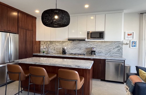 Libertad Condo | New! Slick designer apARTtment with bay views.