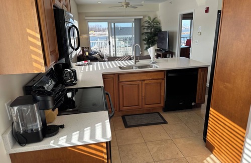 Gypsum Condo | NEW spacious 2 BR/2 BA w. pool, dockage available, bar