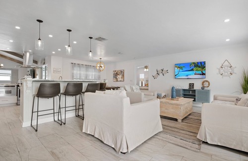 Palma Sola House | ⚓New - Waterfall Retreat! Private heated pool/spa Min from AMI⚓