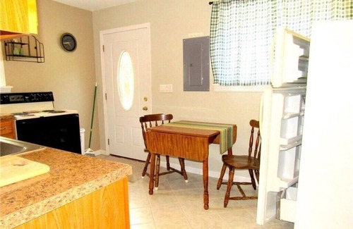 Sunrise Beach House | Newly renovated 1st flr kitchen, dining-living area, 2nd flr bedrooms, and bath.
