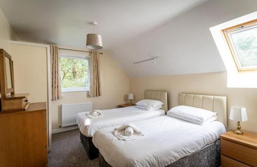Farley House | Norbury, woodland lodge with hot tub for 12